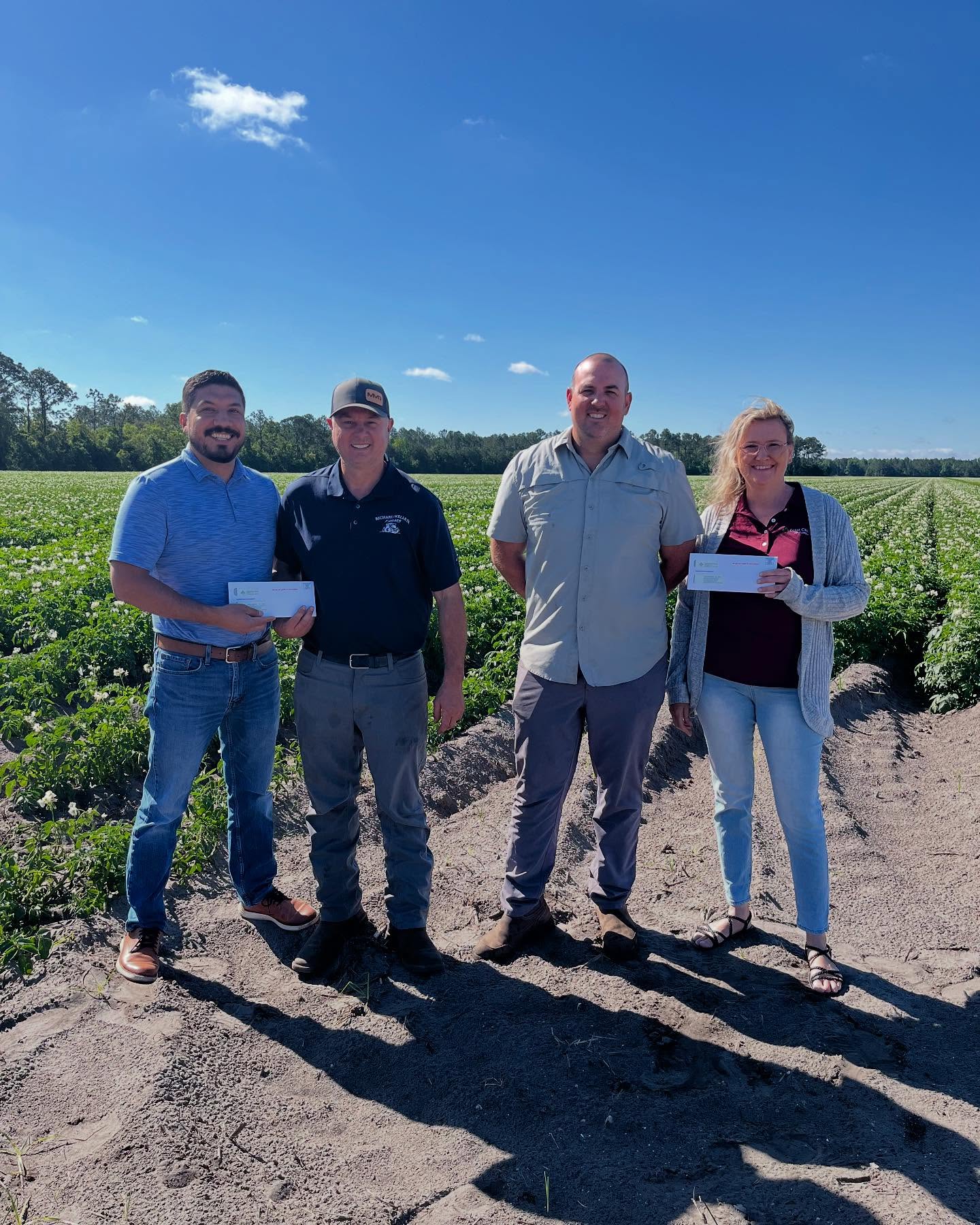 Farm Credit of Florida delivering patronage checks to borrowers